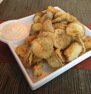 COURTESY YELP Scion serves up contemporary American dishes with a twist, including their fried pickles with a yogurt and dill sauce.