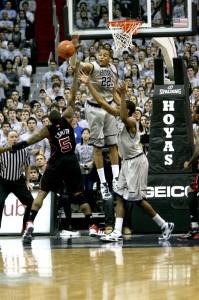 MARISSA AMENDOLIA/THE HOYA Senior forward Julian Vaughn blocks Louisville junior guard Chris Smith. Vaughn finished with four rejections on the evening.