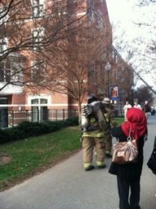 LAUREN WEBER/THE HOYA Jesuits and others wait outside Wolfington Hall Monday morning as firefighters investigate the cause for an alarm.