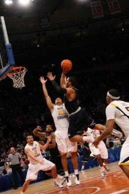 Junior guard Chris Wright elevates for his game-tying layup with 17 seconds to play in Saturday's Big East tournament final.