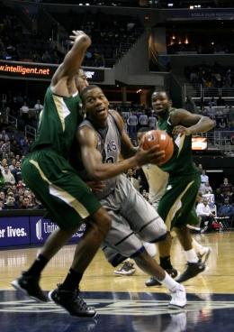 Sophomore center Greg Monroe attempts to drive by a South Florida defender. Monroe had 21 points and eight rebounds.