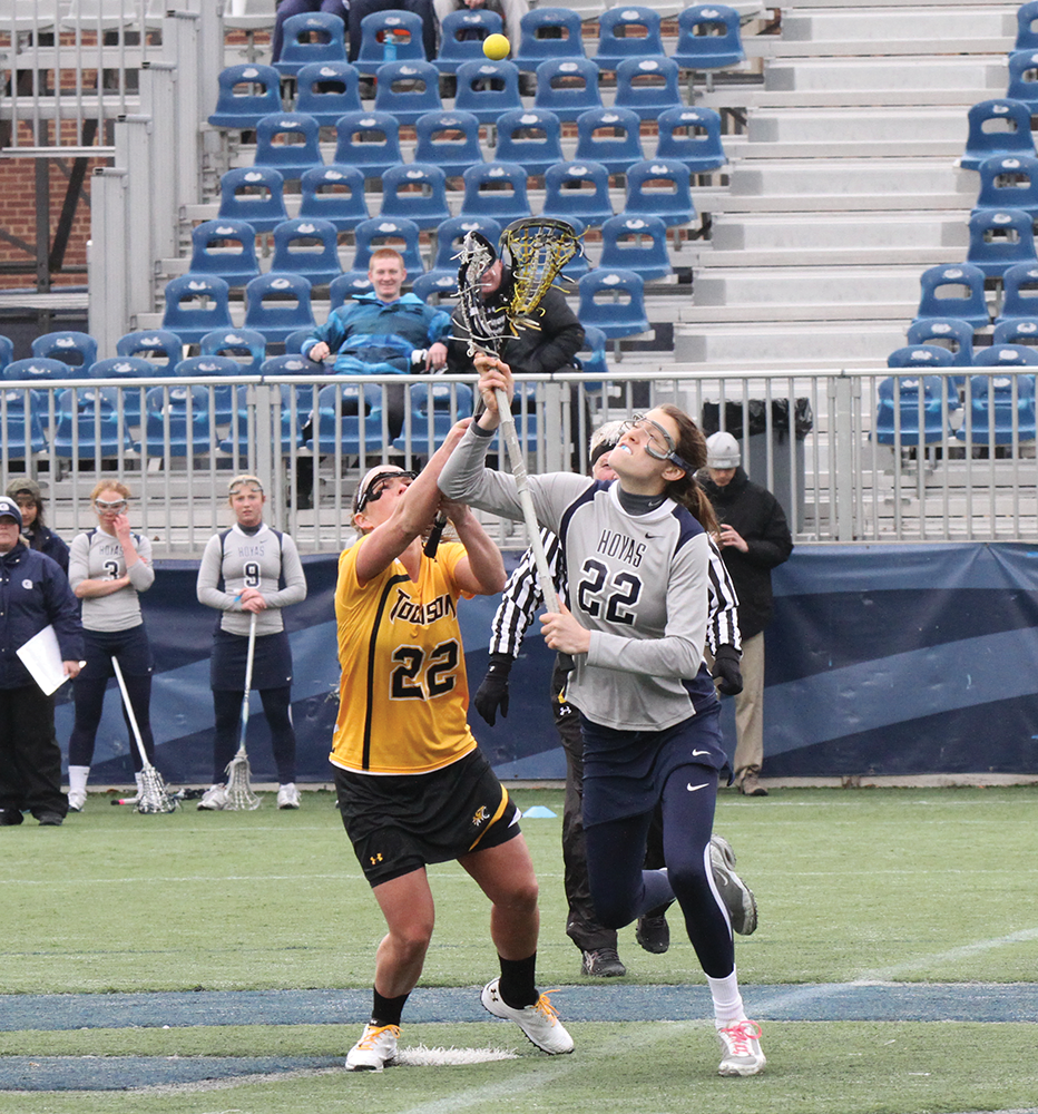 FILE PHOTO: ALEXANDER BROWN/THE HOYA Junior midfielder Kelyn Freedman (right) will have her hands full in the circle Sunday against Notre Dame, going head-to-head with standout Barbara Sullivan.