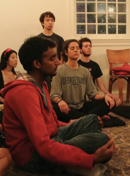 Kristen Skillman/The Hoya Students meditated at a Buddhist Meditiation Sanghra as part of iWeek Monday evening.