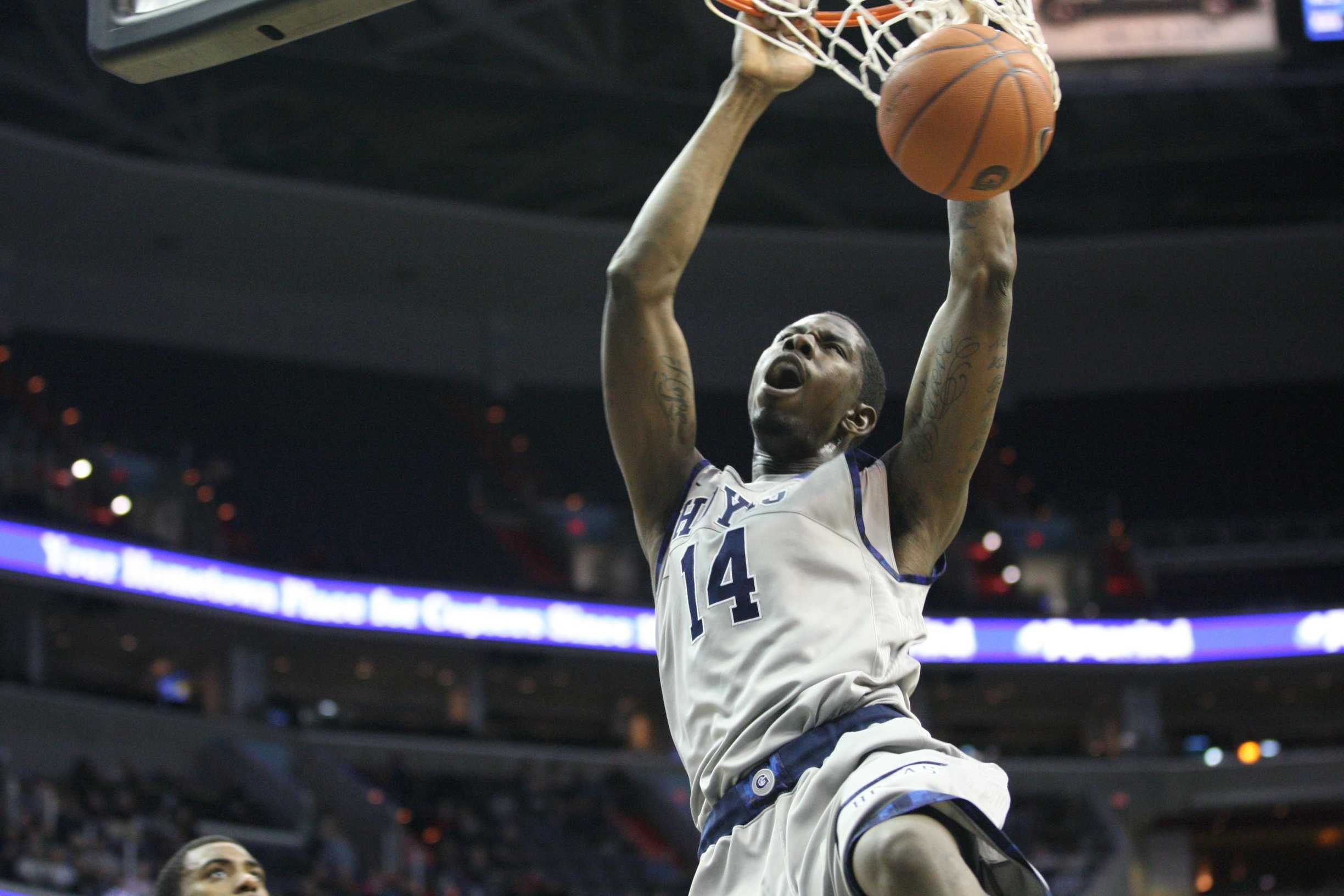 CHRIS BIEN/THE HOYA Junior forward Henry SIms was crucial during the Hoyas' late run in Sunday's 69-60 victory over the Golden Eagles.