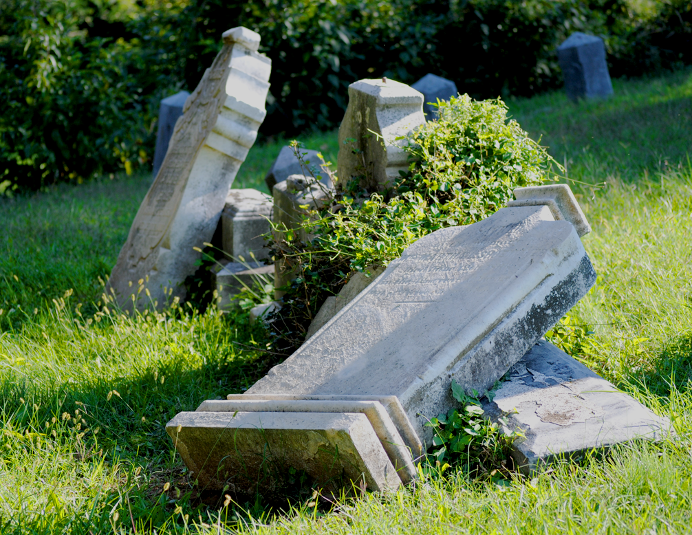 MICHELLE CASSIDY/THE HOYA Fallen tombstones at Holy Rood reflect the oft-overlooked cemetery’s long history, which in recent years has been marked by neglect. 