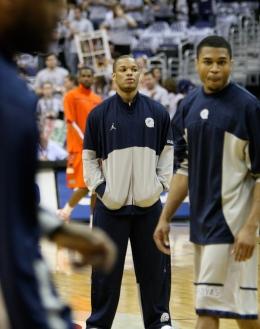 MARISSA AMENDOLIA/THE HOYA Senior guard Chris Wright wasn't able to join the rest of the Hoyas as they battled the Orange on Saturday.