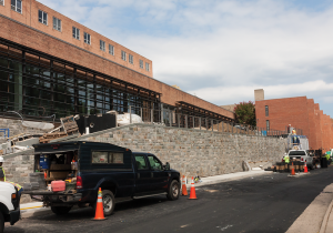 MICHELLE XU/THE HOYA Construction is continuing on the Healey Family Student Center in New South, which will open in September. The center’s auxiliary projects, The Corp’s Hilltoss salad shop and the university’s student pub, have been delayed to fully open later in the semester. 