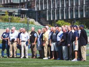 JULIA HENNRIKUS/THE HOYA Members of the 1964 Georgetown football team gathered at midfield of the MultiSport Facility during halftime of Georgetown’s 17-3 win over Brown. The Hoya alumni were honored for their contribution to the program.