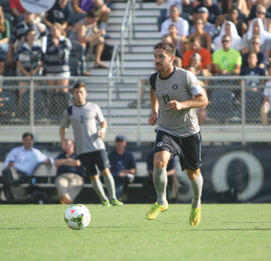 CHRIS GRIVAS/THE HOYA Senior midfielder and captain Tyler Rudy scored a stunning goal in leading the Blue and Gray to a 2-0 win over Harvard on Friday. 