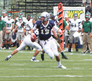 FILE PHOTO: CLAIRE SOISSON/THE HOYA Junior quarterback Kevin Nolan is set to continue his partnership with sophomore wide receiver Justin Hill against the Marist Red Foxes. 