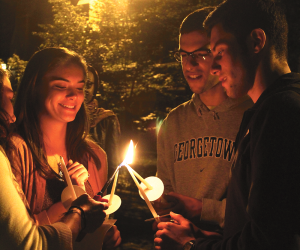 ARIANA TAFTI FOR THE HOYA Students lit candles in memory of the victims of the Israel-Palestine conflict at a vigil on Thursday night.