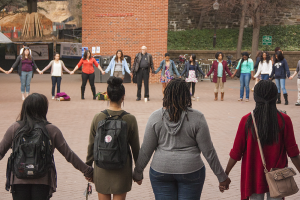 ISABEL BINAMIRA/THE HOYA More than 75 students protested the Ferguson decision in Red Square. 