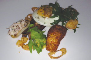 ALLIE HILLSBERRY Despite a high price tag, Iron Gate provides a delicious variety of Mediterranean-inspired cuisine that offers something for the palate of every guest. Pictured is the Berkshire-pork belly with dippy egg and potato fritter.