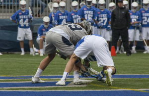 FILE PHOTO: ISABEL BINAMIRA/THE HOYA Graduate student midfielder Gabriel Mendola did not fully assume his role as a faceoff specialist in the team’s loss to Denver due to an injury. 