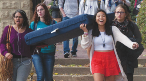 FILE PHOTO: MICHELLE XU/THE HOYA Student activists, including author Zoe Dobkin (SFS '16), back left, carry a mattress during October's Carry the Weight event, a day of sexual assault awareness at college campuses across the country.