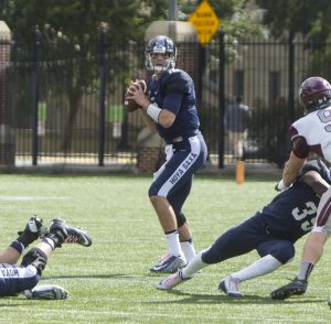 FILE PHOTO: NAAZ MODAN/THE HOYA Senior quarterback Kyle Nolan threw for 94 yards, including a 40-yard touchdown to junior wide receiver Justin Hill, in the Hoyas’ win. 