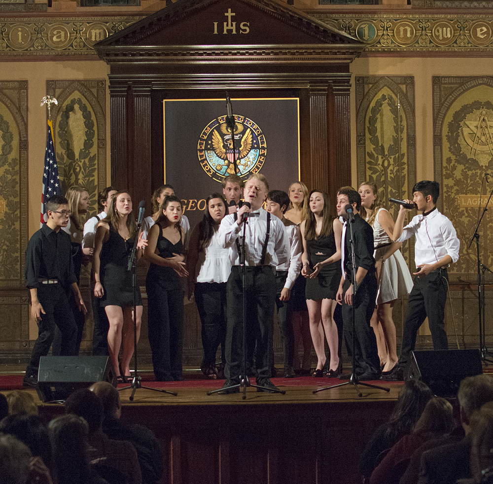 JINWOO CHONG/THE HOYA Zach Rego (MS B ’16) performs with Superfood in Georgetown University’s Gaston Hall, at the first weekend of the D.C. A Cappella Festival, hosted by the Phantoms and the Gracenotes.
