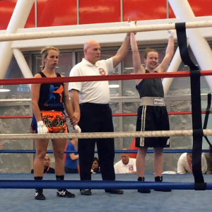 COURTESY GEORGETOWN CLUB BOXING Junior Sinead Schenk, right, won a national boxing title after moving up a weight class to defeat her opponent in the 132-novice bracket. Schenk has now earned two national titles.